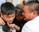 Touching moment Chinese couple are reunited with their long-lost son 22 years after he was abducted by his father’s CO-WORKER
