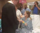 Terminally ill mother fulfills her dying wish of seeing her son graduate when his high school brings an early diploma ceremony to her hospital bedside